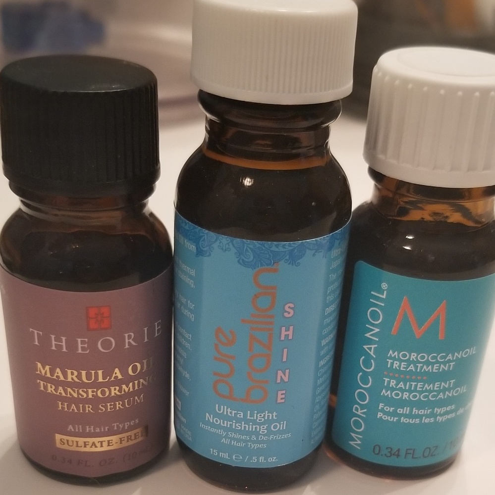 3 bottles of hair care oil